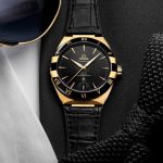 The 18k gold fake watch has black strap.