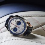 The stainless steel fake watch has a blue strap.